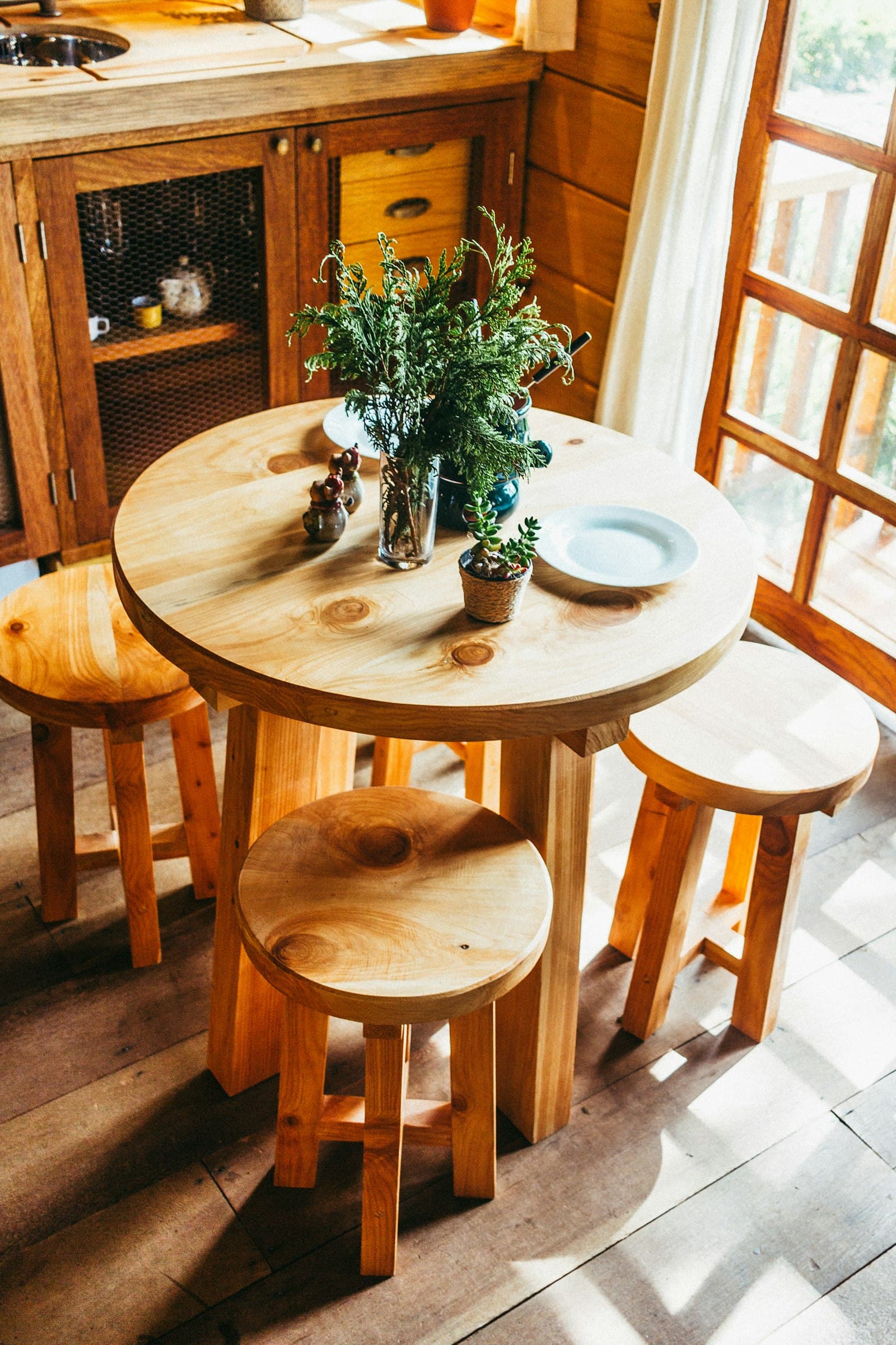 Rustic wooden breakfast nook inside a treehouse